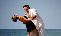 Couple Dancing On The Beach Presentation Template