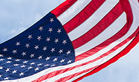 American Flag Waving on Flagpole Presentation Presentation Template