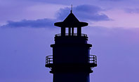 Lighthouse Silhouette Against Purple Sky Presentation Presentation Template