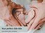 Children's Feet in Heart-Shaped Hands of Mother and Father Presentation slide 1