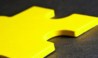 Yellow Jigsaw On A Dark Gray Surface Free Presentation Template