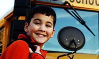 School Bus With Happy Pupil Presentation Template