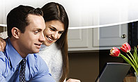 Couple Looking at Laptop Computer Presentation Template