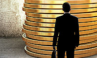 Businessman Standing in Front of Stack of Coins Presentation Template