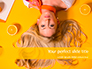 Portrait of Blonde Girl Lying on Yellow Background with Oranges slide 1