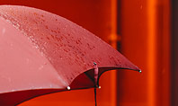 A Person Under Red Umbrella Presentation Presentation Template