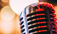 Old Fashion Microphone Against Bokeh Background Presentation Presentation Template