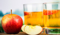 Red Apple and Two Glasses of Apple Juice Presentation Presentation Template