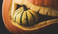 Halloween Carved Pumpkin in Darkness Presentation Presentation Template