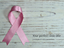 Breast Cancer Pink Ribbon on Wooden Background Presentation slide 1