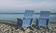 Two Blue Adirondack Chairs on the Beach Presentation Presentation Template