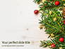 Christmas Tree Branches on Wooden Table Presentation slide 1