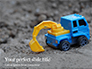 Toy Backhoe on the Sand Presentation slide 1