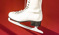 Hanged Pair of White Leather Figure Skates on Red Wall Presentation Presentation Template