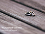 Two Wedding Rings on Wooden Surface Presentation slide 1