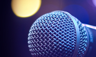 Close Up of Microphone in Concert Hall with Blurred Lights Presentation Presentation Template
